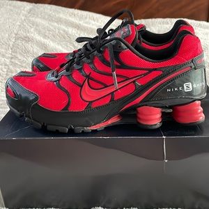 Nike Shox running. Womens 10W. Red and black. Like new. Barely worn. No box